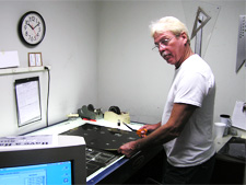 A Worker inspects a project for any flaws